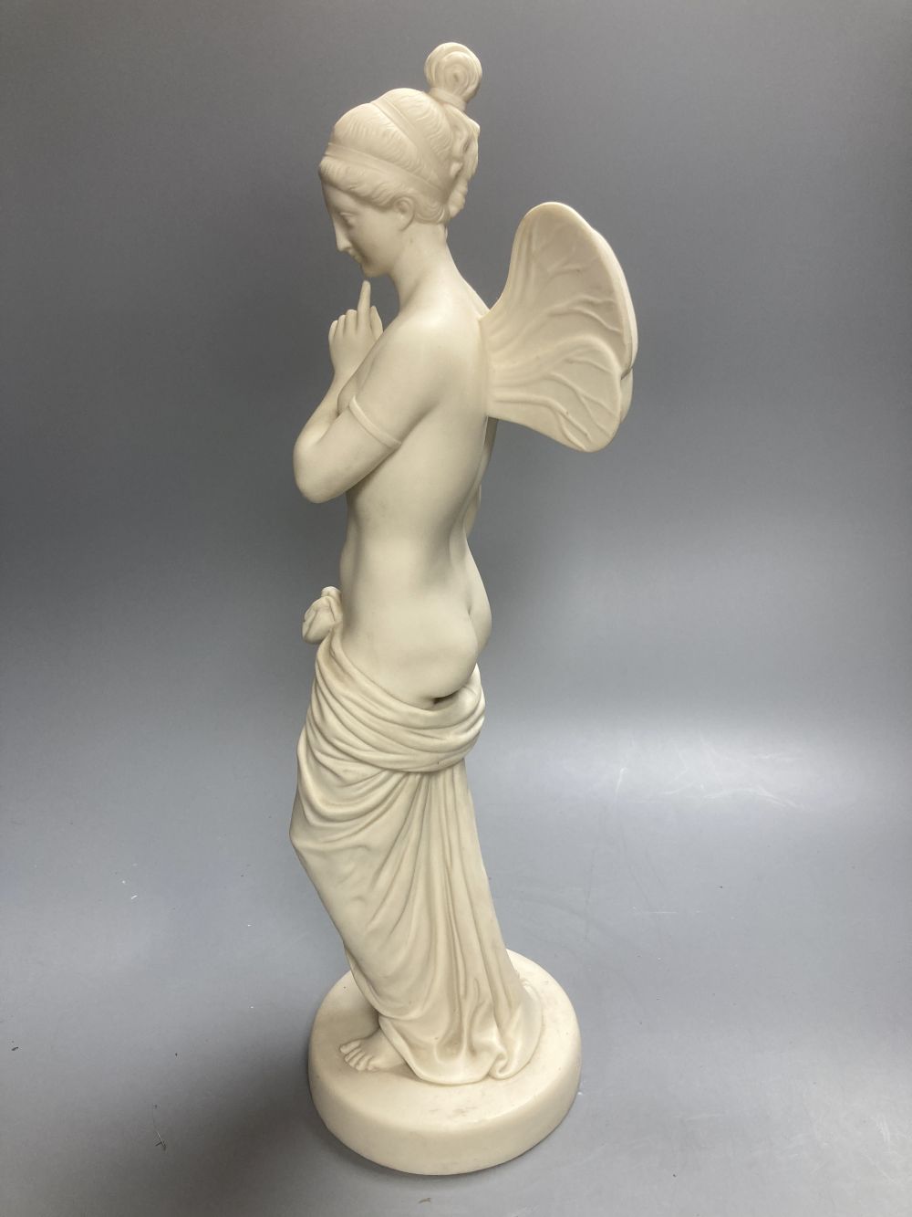 A Copeland Parian figure of a winged maiden and a later composition figure of Venus bathing, H 43cm